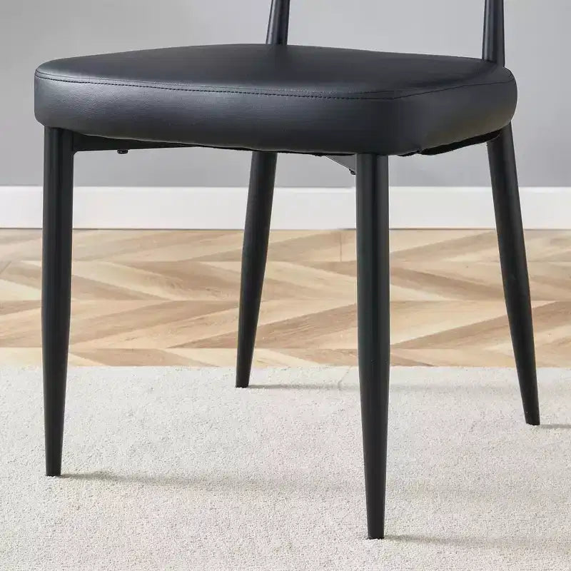 Lot de 4 Chaises de Salle à Manger Noires Minimalistes et Ergonomiques avec Dossier Courbé – Assise en PU